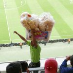 Catering employee selling snacks inside Chivas stadium in Guadalajara