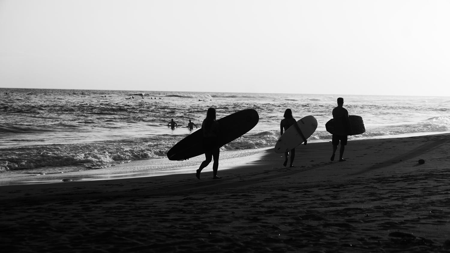 Surfers at El Sunzal beach, El Tunco village, El Salvador