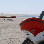 Boats during low tide on Las Penitas beach, near Leon in Nicaragua