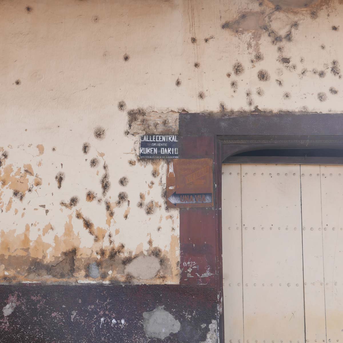 Recent bullet holes in a wall in Leon, Nicaragua